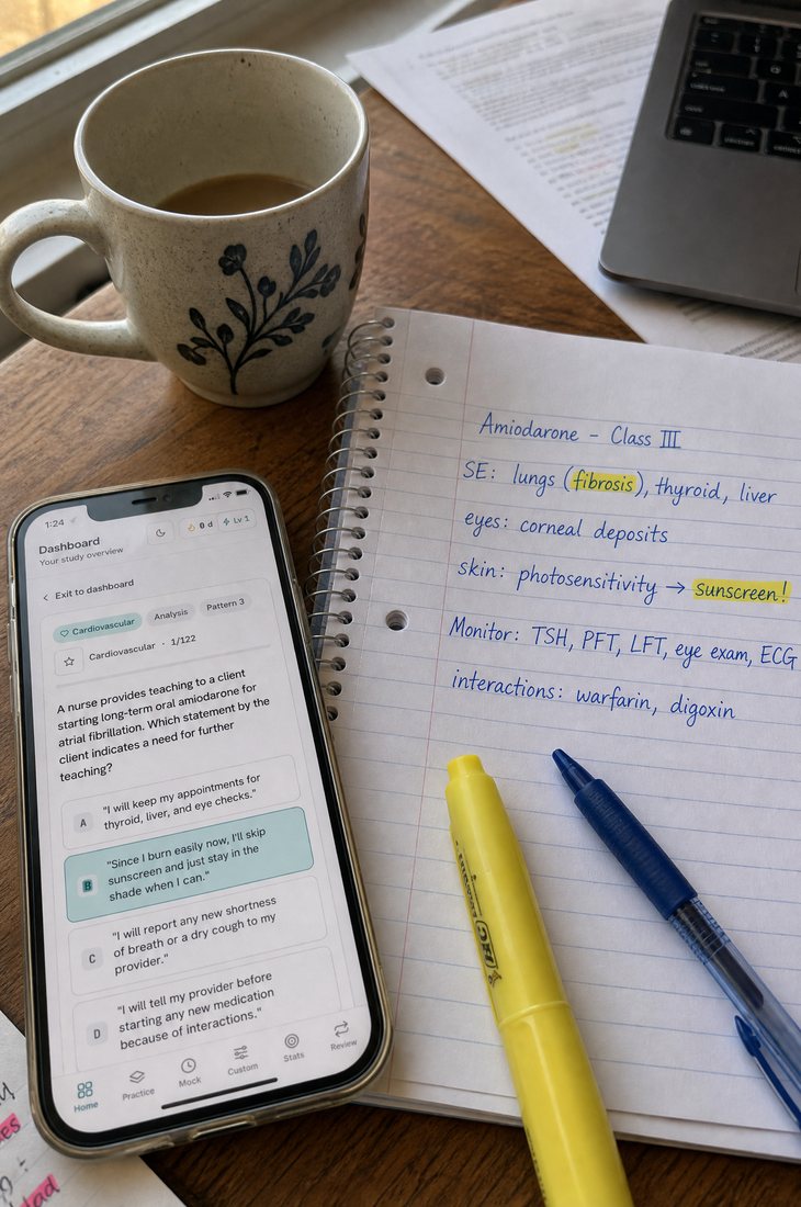 The interactive Question Bank open on a phone on a study desk, showing a pharmacology question with its answer options.